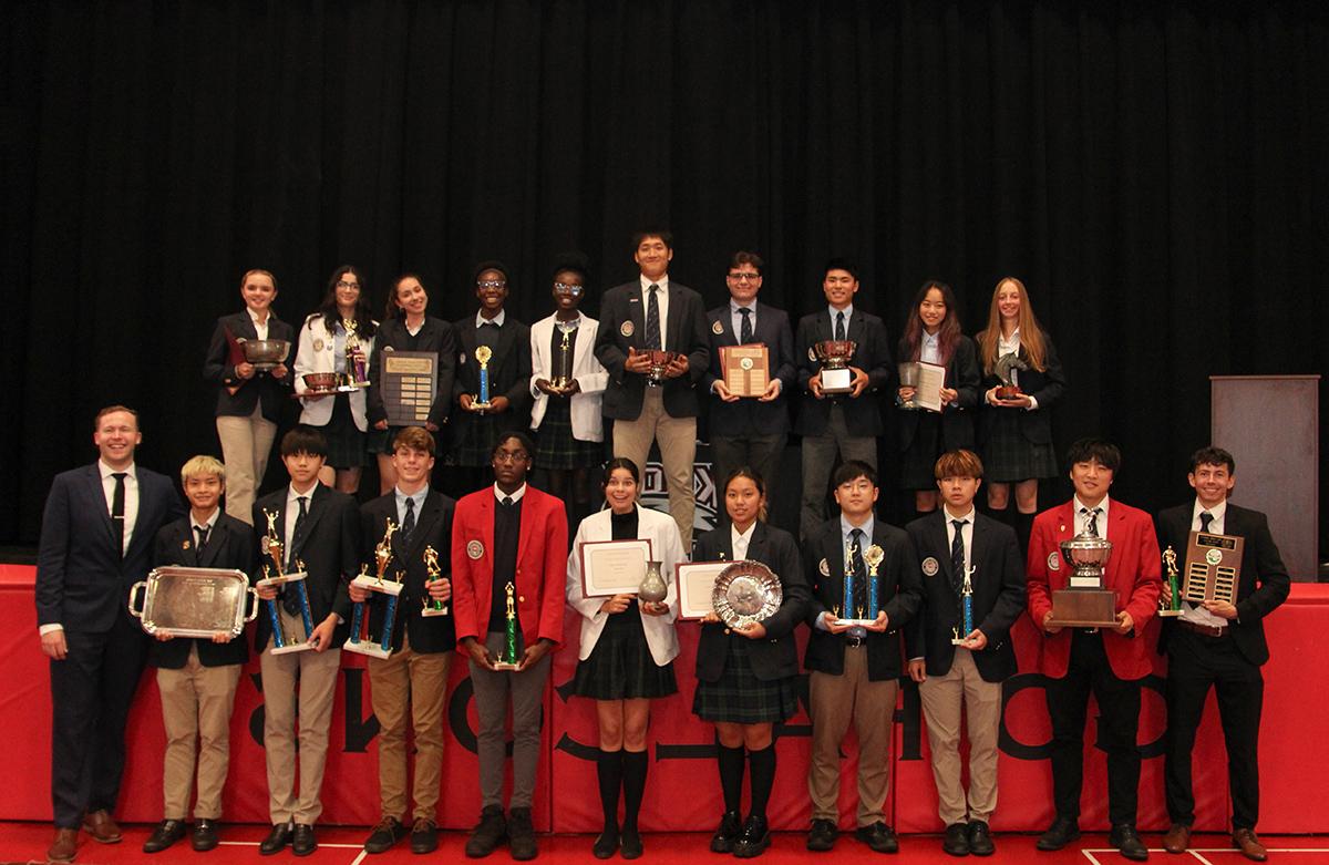 Students Holding Awards from Ceremony
